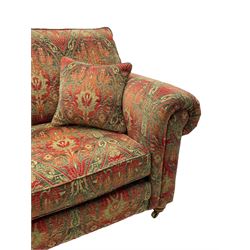 Duresta - 'Beaminster' grande two-seat sofa, traditional shape with rolled arms, upholstered in 'Althorp' russet and stone floral pattern fabric, on turned feet with brass castors
