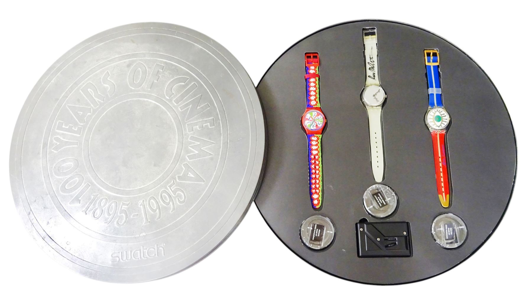 Swatch 100 years of Cinema three quartz wristwatches, each watch with mini film by Robert Altman, Pedro Almodovar and Akira Kurosawa, boxed with mini projector