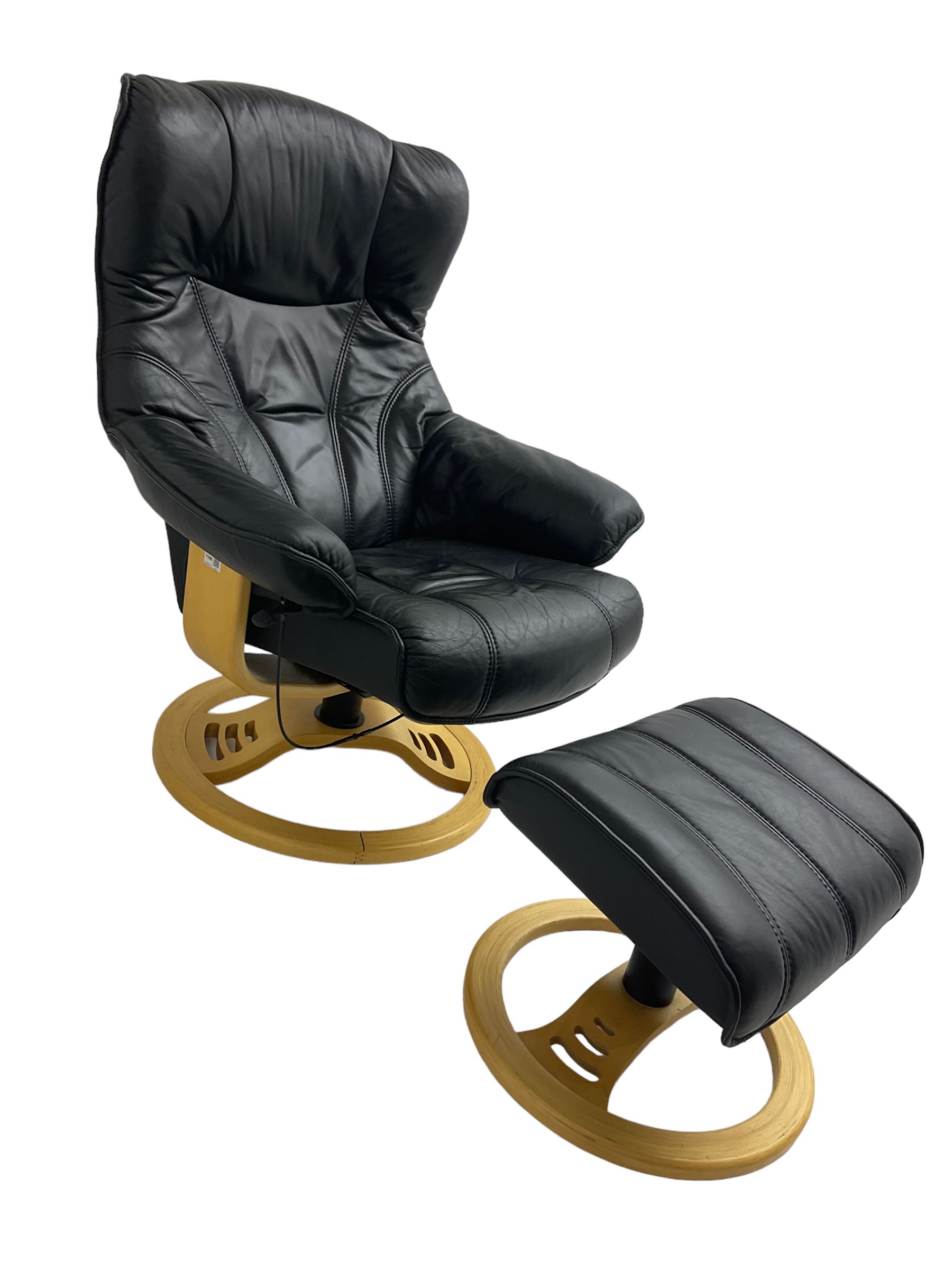 Anderssons of Sweden - mid-20th century design swivel armchair, upholstered black leather, raised on beech U-frame supports with circular base, together with matching footstool 