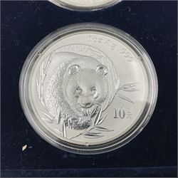 Four one ounce fine silver coins, forming 'The 2003 Famous World Silver Coin Collection', comprising United States eagle, Australian kangaroo, Chinese panda and Canadian maple leaf, cased with Westminster certificate 