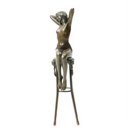 After D H Chiparus, an Art Deco style bronze modelled as a nude female figure seated upon a chair, H28cm.