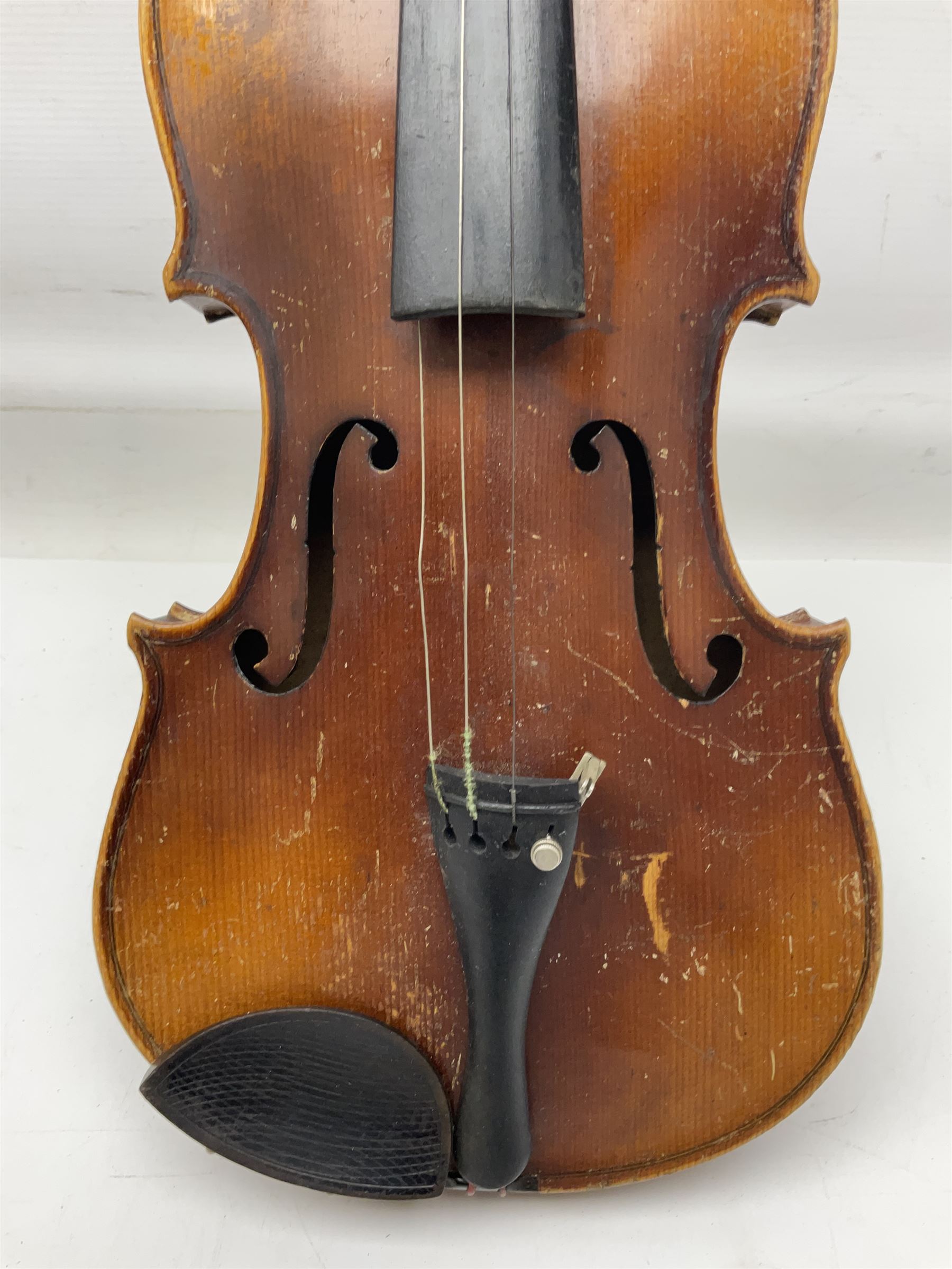 Czechoslovakian violin c1920 with 36cm two-piece maple back and ribs and spruce top, bears label 'Copy of Antonius Stradivarius Made in Czechoslovakia' L59cm; in carrying case; 1950s Czechoslovakian violin; and 195os Czechoslovakian three-quarter size violin; both cased (3)