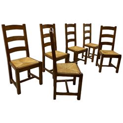 Antix French oak dining table with two leaves, two frieze drawers;, and six ladder back chairs with rush seats