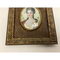 19th century portrait miniature on enamel, depicting a Georgian lady in period dress, hand painted with gilt detailing, in gilt frame with fruiting vine details, overall H13.7cm