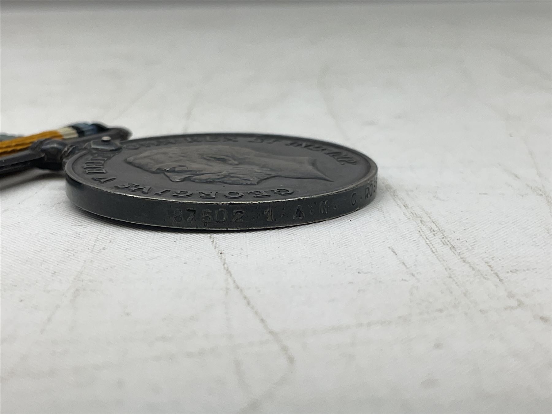 Three WW1 medals comprising 1914-15 Star awarded to 58648 Spr. C. Roberts R.E.; British War Medal and Victory Medal awarded to 87502 1.A.M. C. Roberts R.F.C.; and REME cap badge (4)