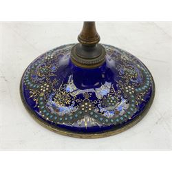 French enamelled candlestick, with floral decoration and gilt detail upon a blue ground, H14cm