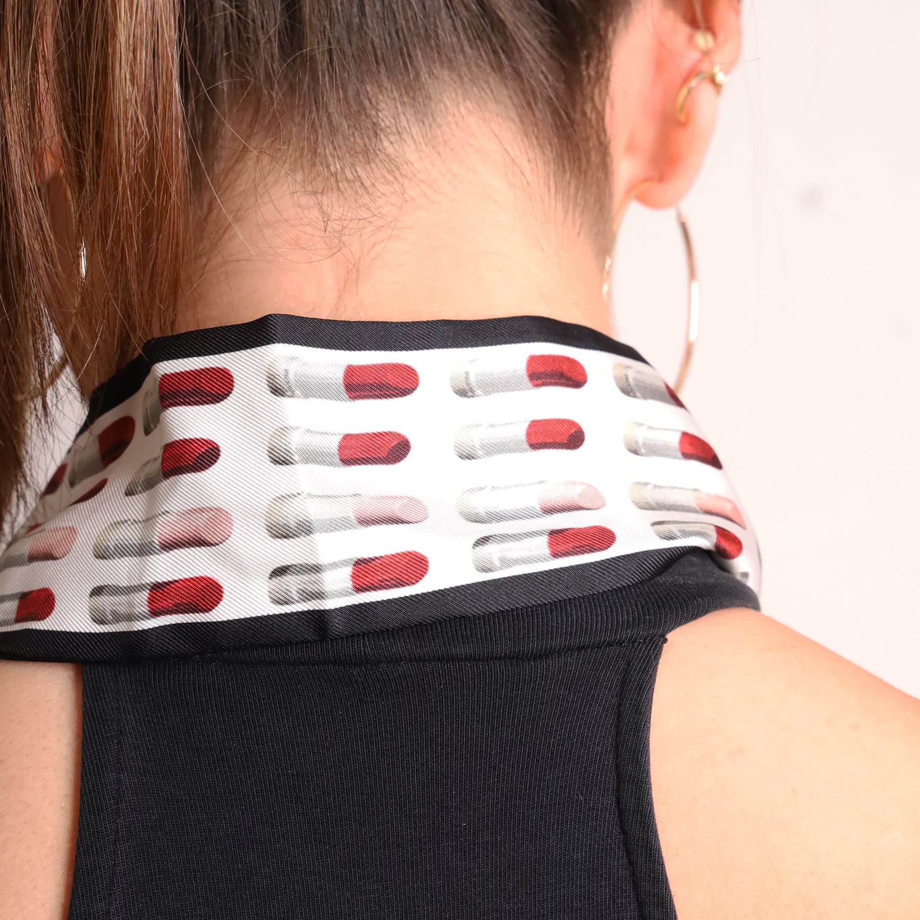 Prada - silk twill skinny scarf, decorated with repeating lipstick motif in red, pink and grey, with black border