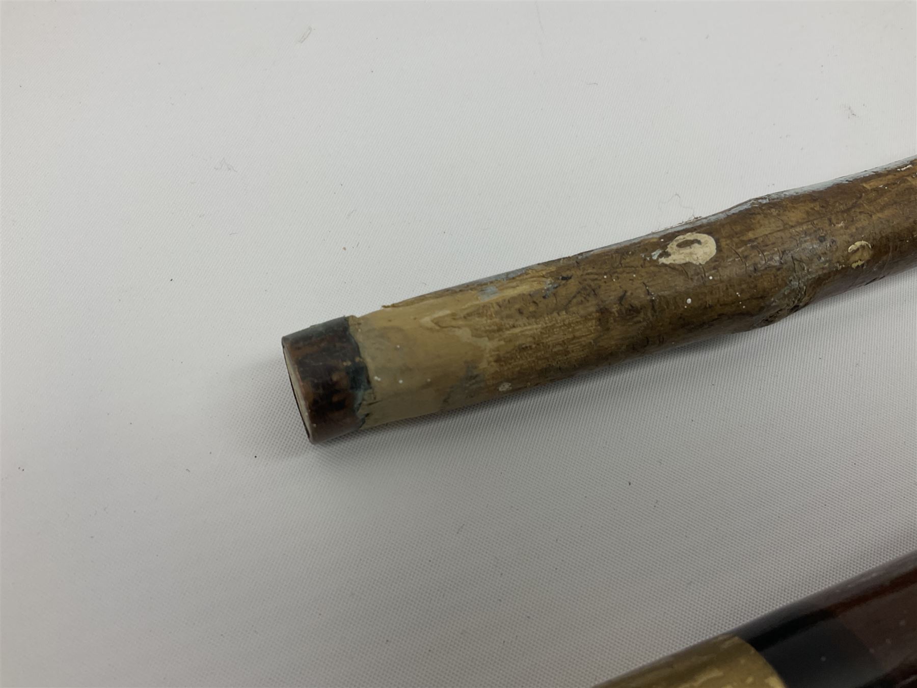 Four wooden walking canes, including a carved mahogany snooker cue example, tallest H86cm