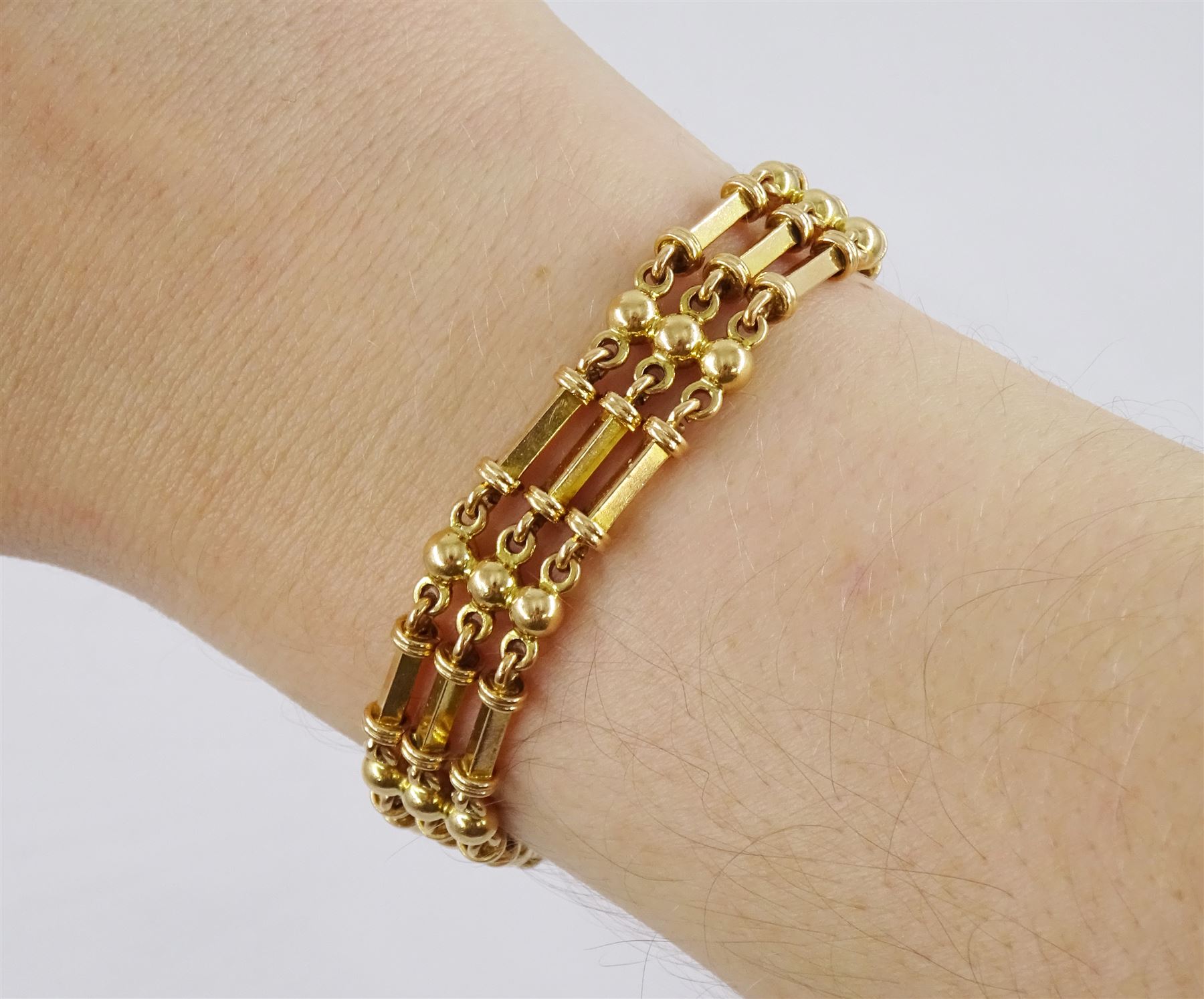 Early 20th century 15ct rose gold gold rectangular and bead link bracelet, stamped 15c