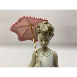 Two Lladro figures, comprising Garden Classic, no 7617 and Garden Song, no 7618, with original boxes and artists signature beneath, largest example H23cm