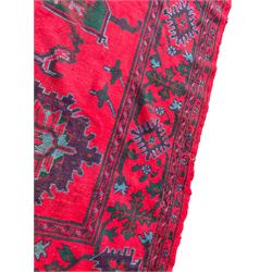 Early 20th century Western Anatolia Turkish Oushak crimson ground carpet, decorated with large Palmettes with trailing branches, the main border decorated with repeating stylised motifs within guard stripes 