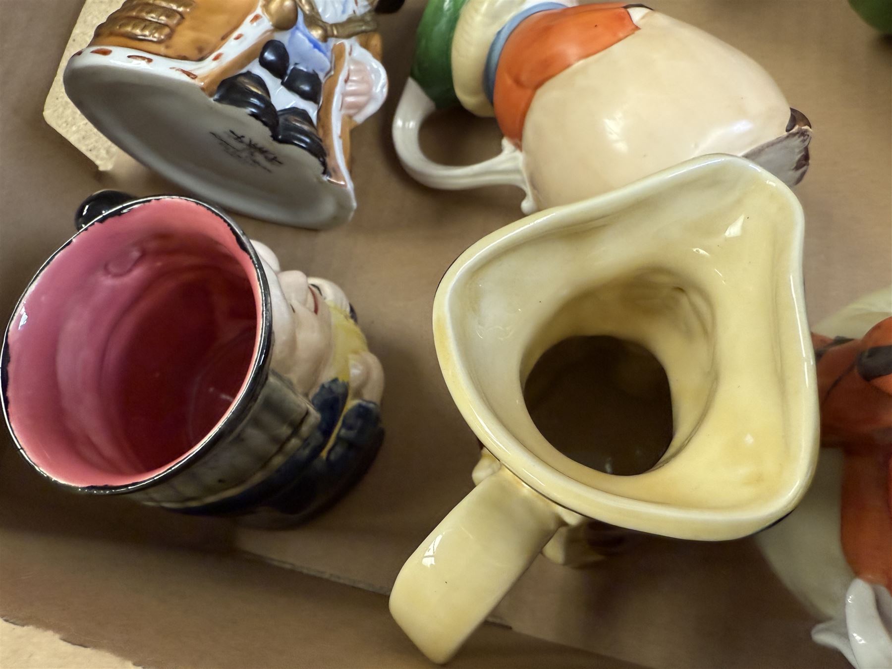19th century ceramic toby jug with gold anchor mark to base, together with a collection of other toby jugs, tallest H21cm