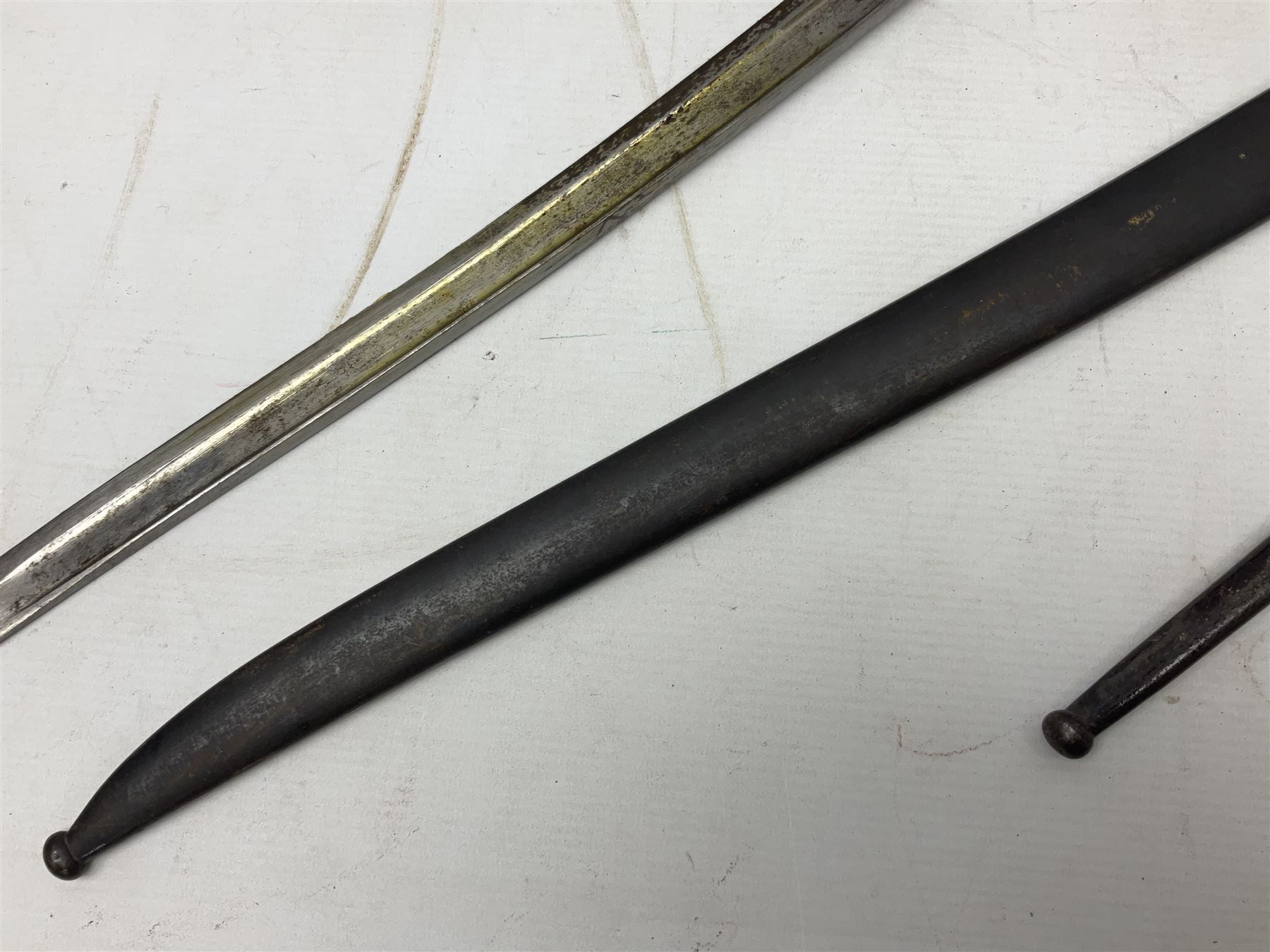 French Model 1866 Chassepot bayonet with 57cm curving fullered steel blade dated 1873 No.L63963; in steel scabbard with conforming number L71.5cm overall; and French St. Etienne Gras bayonet dated 1878 No.K10674 in steel scabbard numbered 79437 (2)