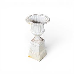 Victorian design white painted cast aluminium garden urn on plinth, fluted bowl on squat pedestal, tapering base
