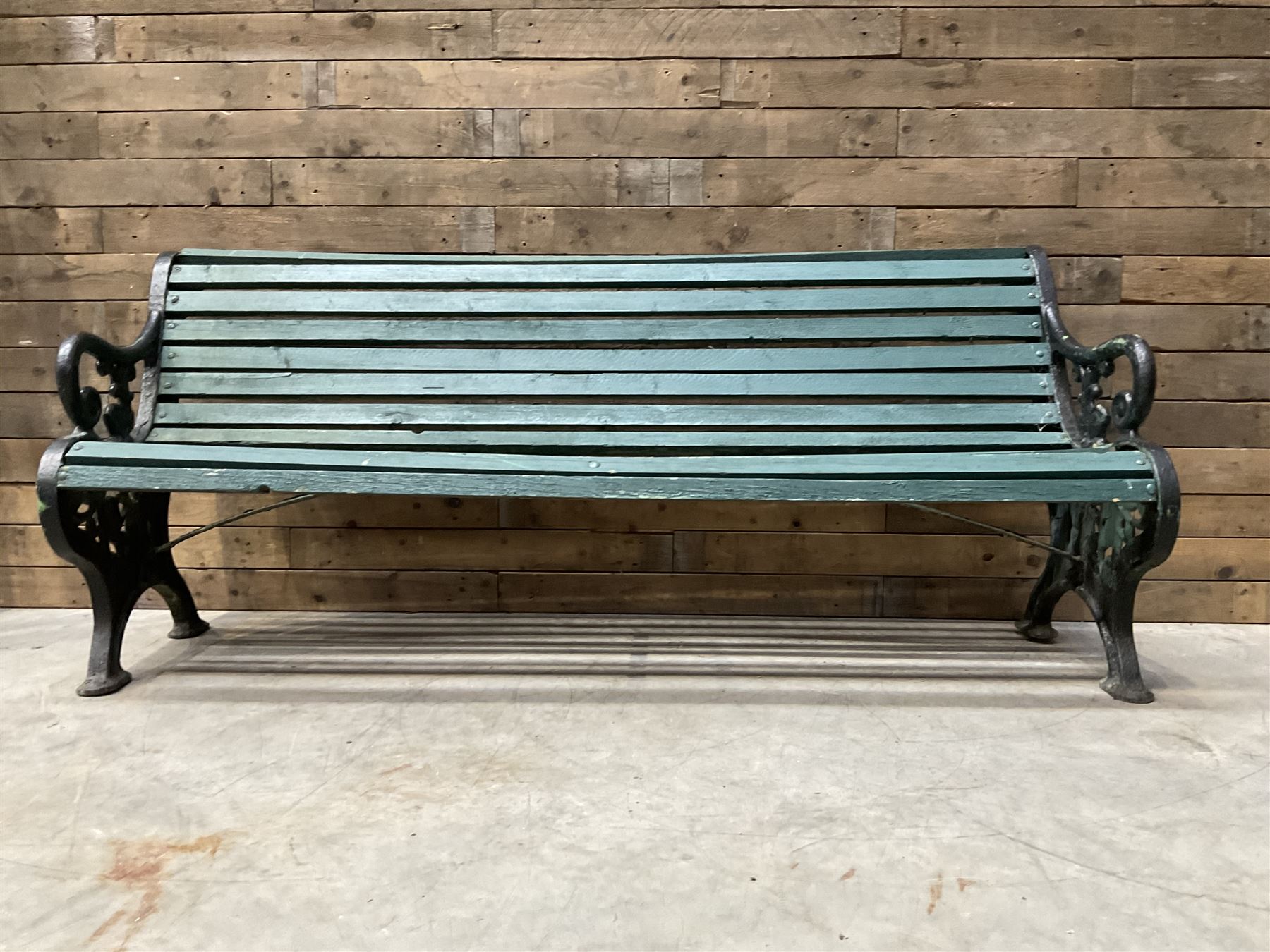 Early 20th century slatted garden bench with scrolling cast iron bench ends
