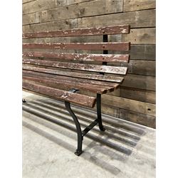 Wrought metal and wood slatted garden bench