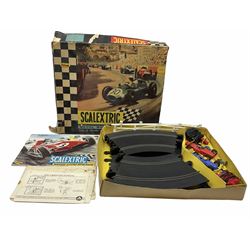 Scalextric - Marks & Spencer Starsky & Hutch set with '76 Gran Torino and Chevrolet Corvette cars, boxed; an earlier Tri-ang Scalextric 'Set 30' Model Motor Racing set containing Lotus and Cooper racing cars with controllers, track, figures and instruction pack, boxed; and a Scalextric catalogue Fifth edition c1964