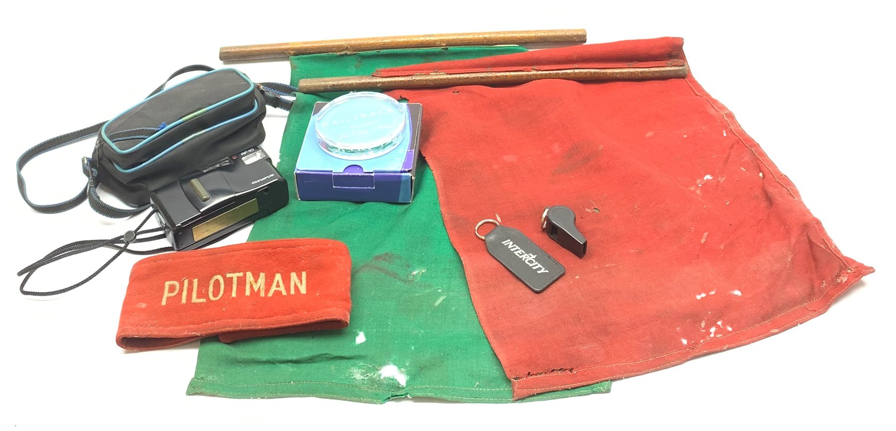  British Rail 'Pilotman' armband, British Rail Guard's red and green flags and Acme whistle, BR 1988 presentation camera and 1996 paperweight and Intercity keyring  