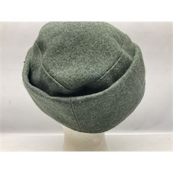 WW2 German Army M43 field cap with triangular cloth eagle and roundel badge and metal edelweiss badge for mountain troops; faintly stamped '5 VMF(?)'
