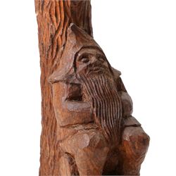 Gnomeman - an oak table lamp, with carved gnome figure seated on a log at the base of a tree stump, on a tooled base, by Thomas Whittaker of Littlebeck, H28cm excluding fitting