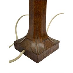 'Mouseman' circa. 1950s tooled oak table lamp, the figured octagonal tapered stem carved with mouse signature, by Robert Thompson of Kilburn