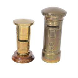 Early 20th century moneyboxes, including trench art example, Bakelite example with applied West Africa Two Shilling coin engraved 'Joan', three brass pot boxes and a wooden ebonised example with brass mounts, tallest H15cm