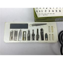 An electric mini drill with accessories, electric engraving tool, mini grinder, electric multi-tester, cutting knives and blades.