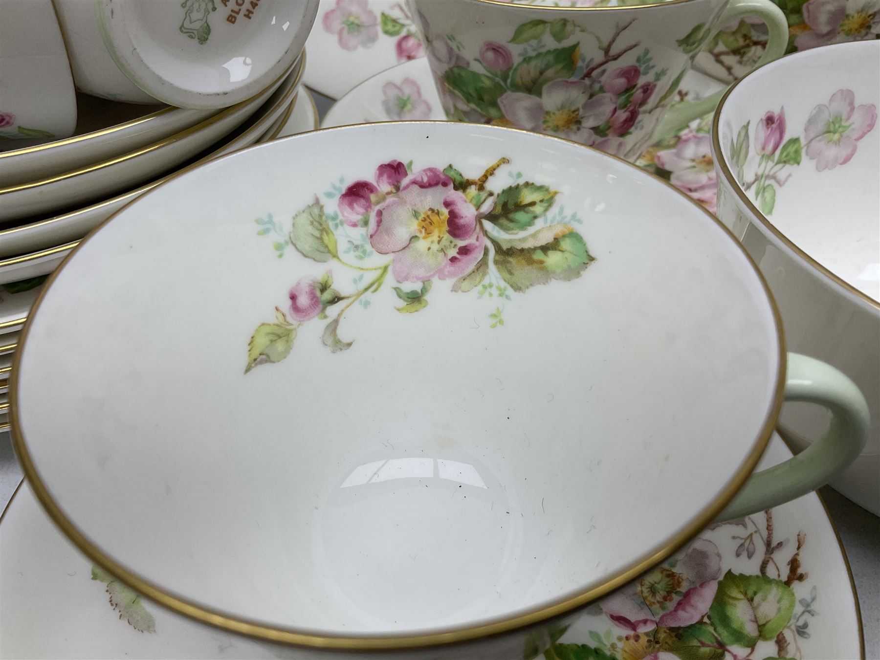 Royal Doulton Apple Blossom pattern tea service for twelve, comprising twelve saucers, twelve tea plates, twelve teacups, milk jug, sucrier and two cake plates