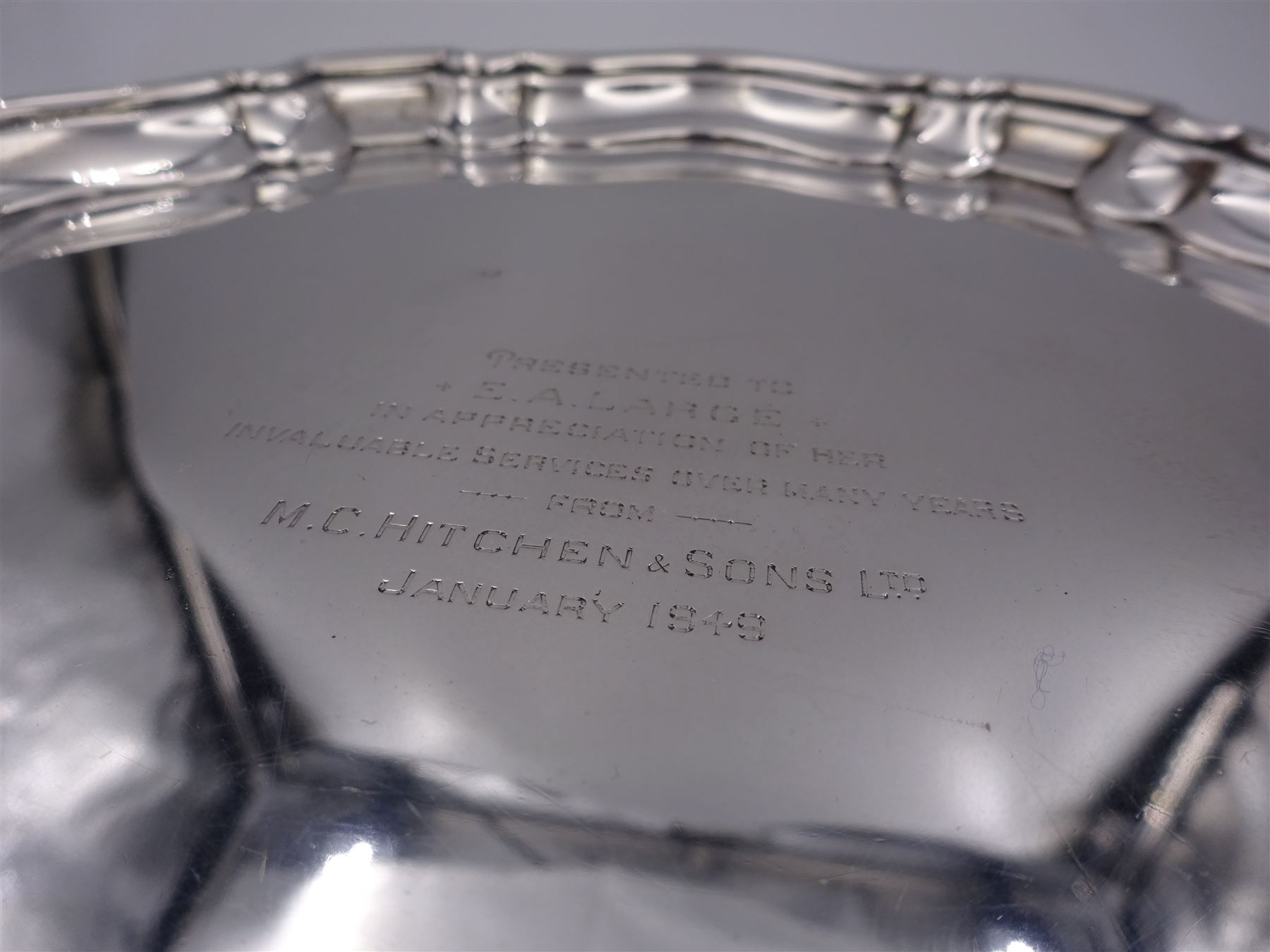 1940's silver waiter, of circular form with Chippendale type rim and personal engraving to centre, upon three scroll feet, hallmarked William Suckling Ltd, Birmingham 1934, D20cm, approximate weight 10.70 ozt (332.9 grams)