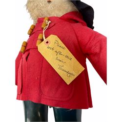 Gabrielle Designs Paddington Bear in a red felt jacket and black felt hat, c1972. Dunlop bottle green wellingtons and Darkest Peru label. H54cm