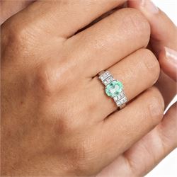 18ct white gold Paraiba tourmaline and diamond ring, single oval cut tourmaline of approx 0.90 carat, with six princess cut diamonds either side, in a stepped design setting, hallmarked, total diamond weight approx 0.35 carat