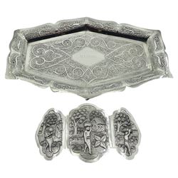 Eastern silver tray, of shaped form with central named panel within a scroll and foliate engraved surround, L22.5cm, together with an Eastern silver belt buckle of shaped tri-part form, decorated with figures at working in a landscape settings, L12cm, approximate weight 7 ozt (218 grams)