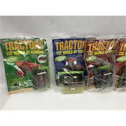 Eighteen issues of Tractors and The World of Farming magazine, together with sixty diecast tractors, all in original packaging, in three boxes 