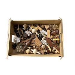 Box of assorted wooden turned finals and various wooden clock case ornaments.