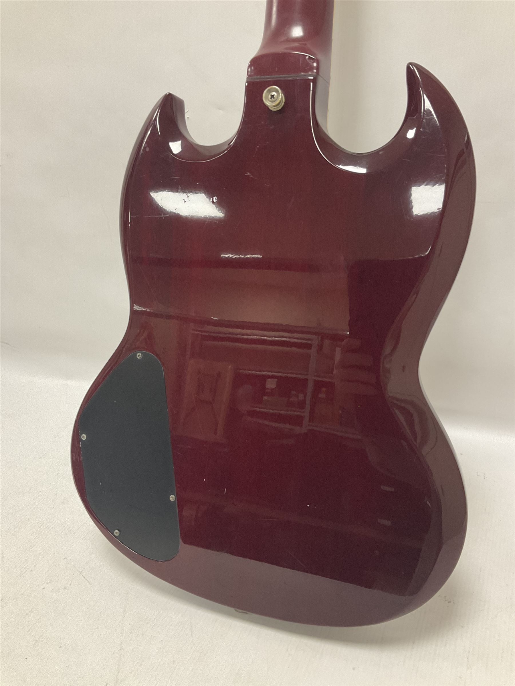 Gibson Epiphone SG six string electric guitar, with cherry red mahogany finish and black scratch guard, L102cm