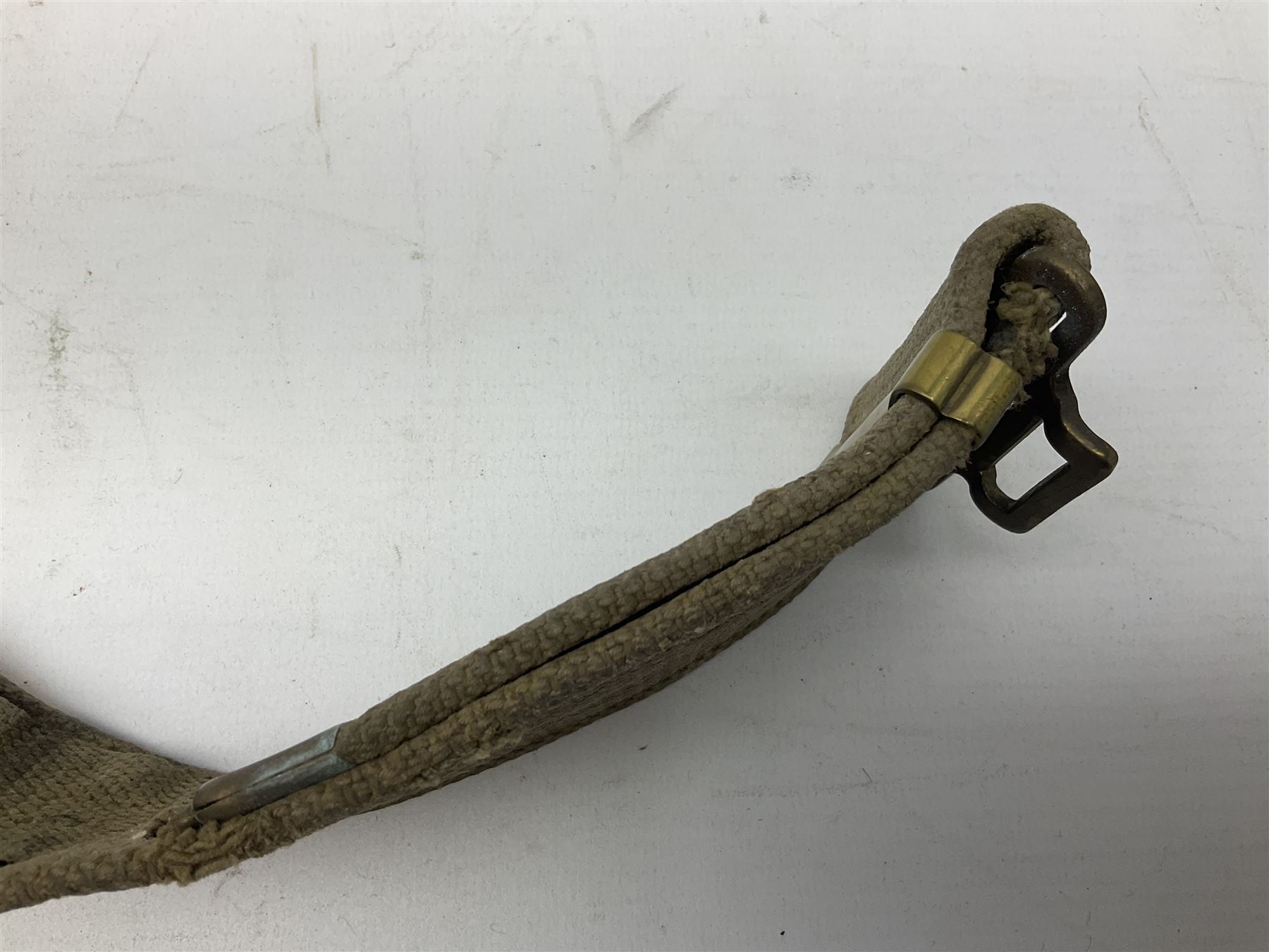 WW2 British black felt beret with Pioneer Corps cap badge, with Kangol Wear maker's mark dated 1943; and a British Army green webbing belt (2)