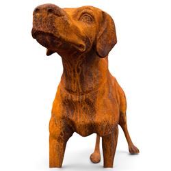 Pair of weathered cast iron garden statues in the form of standing foxhounds with outstretched tails and collars, in rusted patina