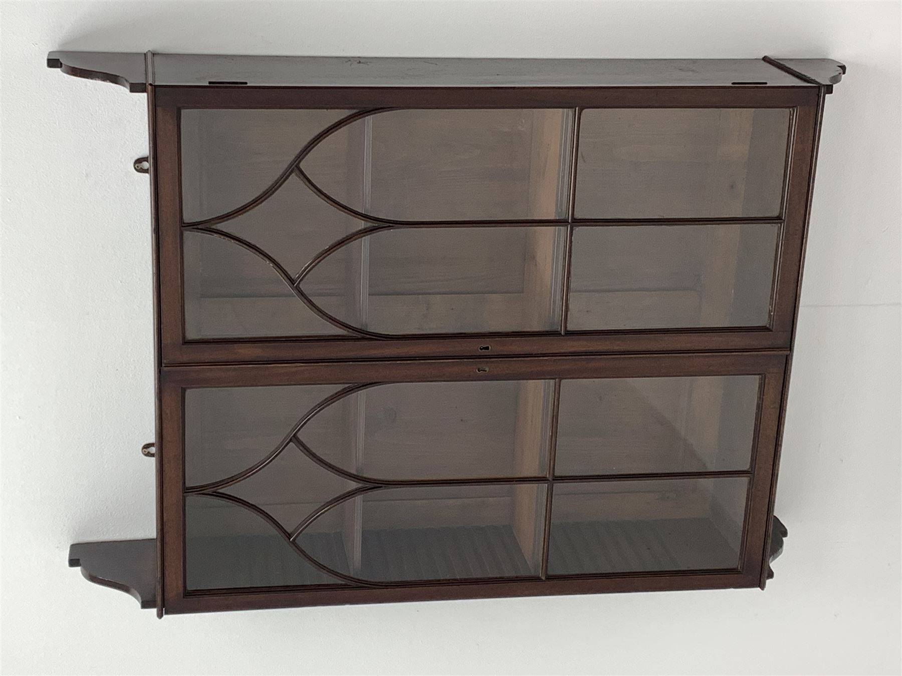 Georgian mahogany Gothic wall hanging cabinet, enclosed by two ogee pointed arch astragal glazed doors, plain sides with shaped top and bottom brackets