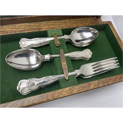 Silver plated canteen of kings pattern cutlery, house in oak canteen of trapezium form 