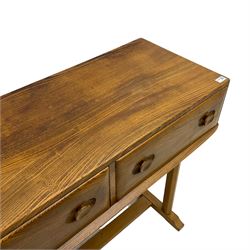 Ercol - circa. 1960s elm and beech side or console table, fitted with two drawers, pillar supports on sledge feet joined by stretcher 