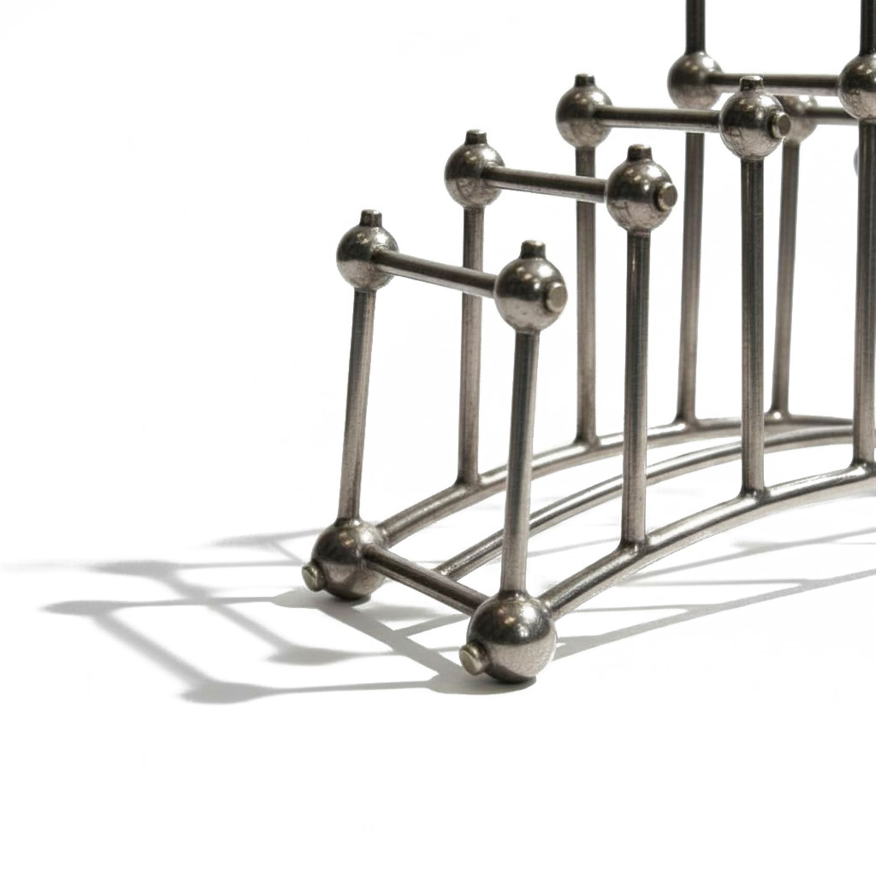 Christopher Dresser (1834-1904) for Hukin & Heath, silver plated six division bridge toast rack, circa 1880, Stamped makers marks and model number 2554, H12cm