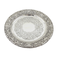 Victorian silver waiter in the Classical Revival style, the pierced border featuring a frieze of masks, lions, cornucopia and fruiting vines within a folded laurel rim, the centre engraved with phoenix, swag and scrolling foliage, on three lion paw feet by Mappin & Webb (John Newton Mappin), London 1898, approx 16.8oz