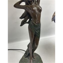 Tiffany style lamp in the form of a semi nude woman holding up a leaded lampshade together with a similar table lamp