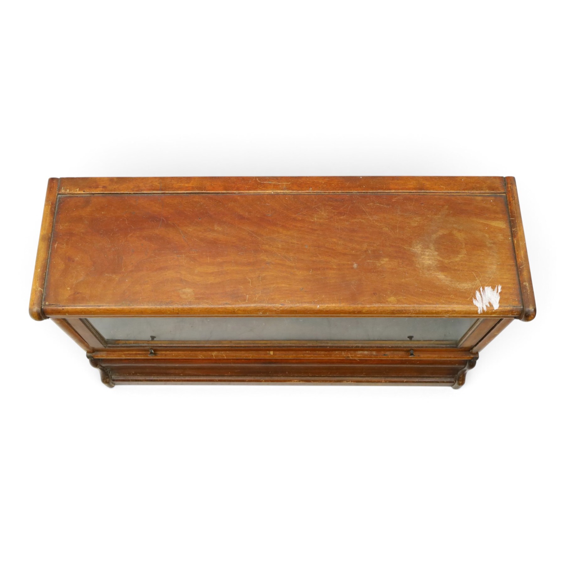 Globe Wernicke - early 20th century mahogany two-tier stacking library bookcase, fitted with glazed up-and-over doors, two drawers to the plinth base; together with a similar single-tier example (W87cm D27cm H54cm)