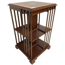 Edwardian Revival inlaid mahogany two-tier revolving bookcase, square top with central fan motif inlay and satinwood banding, on ogee feet