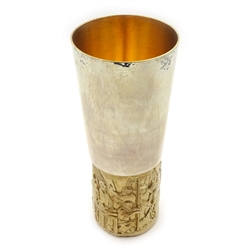  AURUM - The York Minster goblet by Hector Miller for Aurum, London 1972, limited edition 334/500, of tapered cylindrical form, the bowl of plain silver with planished finish, the gilt foot with cast and chased decoration depicting the restoration of York Minster 16.5cm, 16.4oz  with original fitted box and paperwork  
