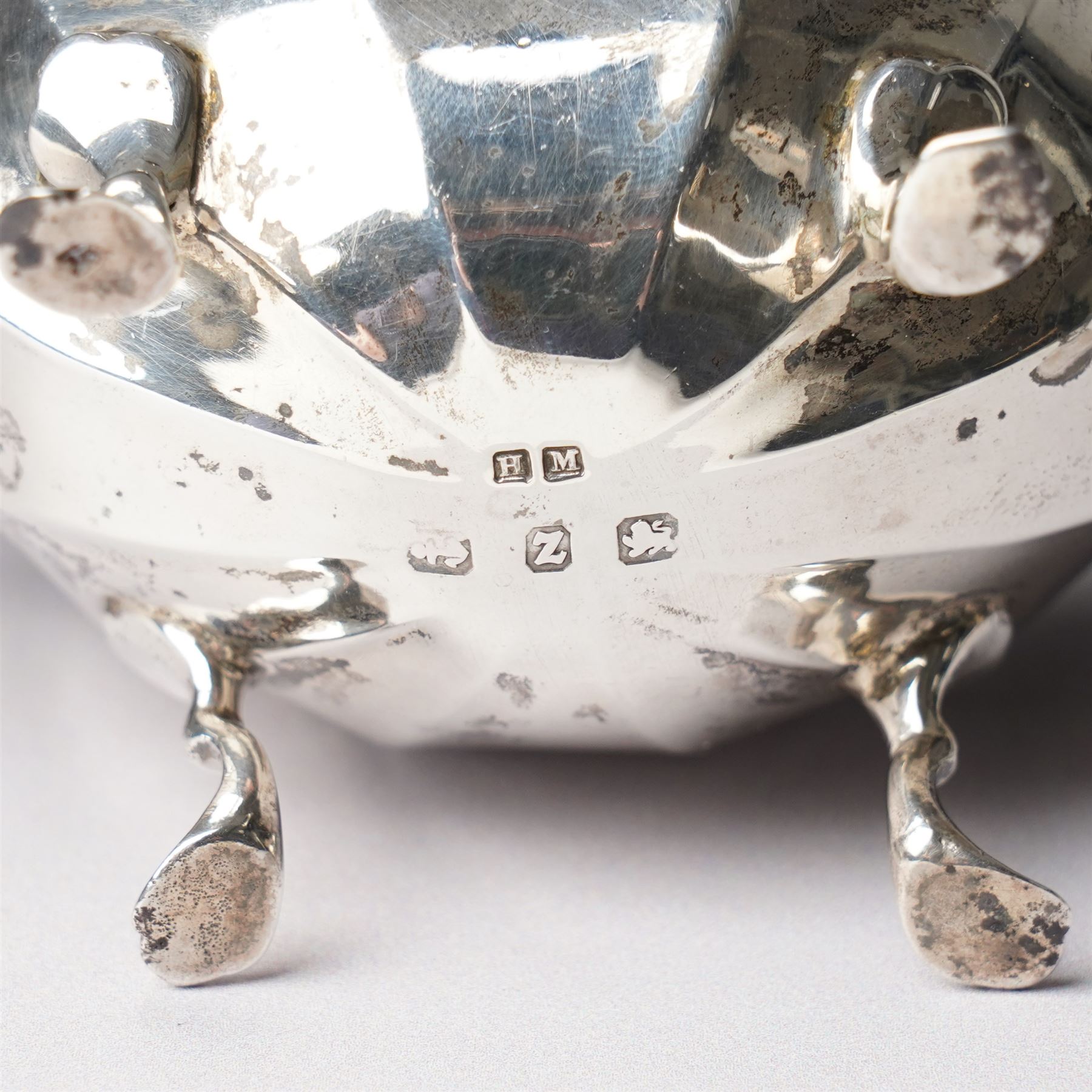 Pair of late Victorian silver salts of oval panel sided design with scroll handles and shaped supports Birmingham 1899 Maker Henry Matthews and two later silver salt spoons 