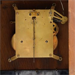 Arts and Crafts oak and brass mounted mantel clock, Hamburg-American Clock Company (HAC), for Liberty & Co, the eight day movement with bell strike, repousse dial with Arabic numerals H36.5cm

  