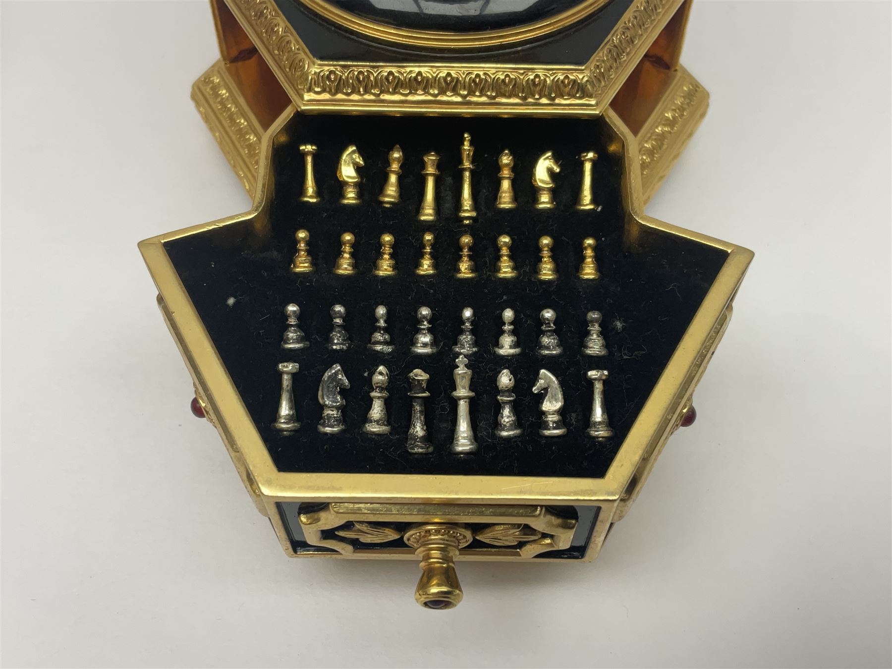 Franklin Mint House of Faberge; The Imperial Jeweled Egg Chess set, the egg opening to reveal a chess board, with a draw to the hexagonal base holding the miniature chess pieces, H23cm 
