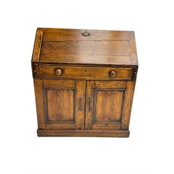 19th century waxed pine bureau, the fall front opening to reveal fitted interior with two drawers and five pigeonholes, base with single drawer over two panelled cupboard doors, on plinth base